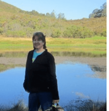 photo of Ms. Gustafson in front of a pond 
