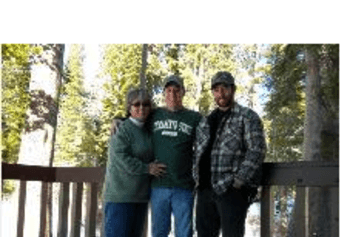 photo of Mrs. Humphrey outdoors in a forest with her family