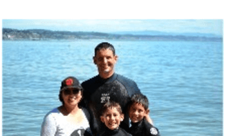photo of Mrs. Neilson with her family by the ocean